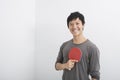 Portrait of happy mid adult man holding table tennis paddle Royalty Free Stock Photo