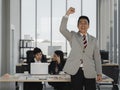 happy asian business man raised fist celebrating succuss Royalty Free Stock Photo