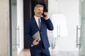 Portrait Of Happy Middle Aged Businessman In Suit Walking Out Of Office Royalty Free Stock Photo