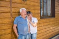 Portrait of happy of middle aged couple against the background of house. Copy space Royalty Free Stock Photo
