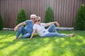 Portrait of happy of middle aged couple on a green grass Royalty Free Stock Photo