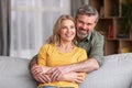 Portrait Of Happy Middle Aged Husband And Wife Posing At Home Interior Royalty Free Stock Photo