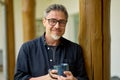 Portrait of middle aged man at home drinking coffee outdoor Royalty Free Stock Photo