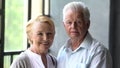 Portrait of happy middle-aged retired family couple relaxing at home. Royalty Free Stock Photo