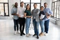 Portrait of happy millennial diverse professional team in loft office