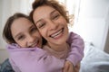 Portrait of happy mom and teen daughter hugging Royalty Free Stock Photo