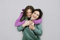 Portrait of happy mom and teen daughter spend time together. Teenage girl hugging her mother and having fun together Royalty Free Stock Photo