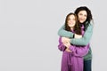 Portrait of happy mom and teen daughter spend time together. Teenage girl hugging her mother and having fun Royalty Free Stock Photo