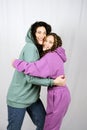 Portrait of happy mom and teen daughter spend time together. Teenage girl hugging her mother and having fun Royalty Free Stock Photo