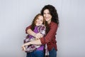 Portrait of happy mom and teeneger daughter spend time together. Teenage girl hugging her mother Royalty Free Stock Photo