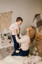 Portrait of happy mother and adorable baby celebrate Christmas. New Year`s holidays Royalty Free Stock Photo