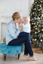 Portrait of happy mother and adorable baby celebrate Christmas. Royalty Free Stock Photo