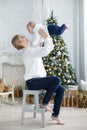 Portrait of happy mother and adorable baby celebrate Christmas. Royalty Free Stock Photo