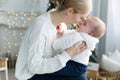 Portrait of happy mother and adorable baby celebrate Christmas. Royalty Free Stock Photo