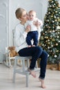 Portrait of happy mother and adorable baby celebrate Christmas. Royalty Free Stock Photo