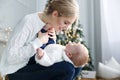 Portrait of happy mother and adorable baby celebrate Christmas. Royalty Free Stock Photo