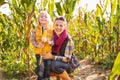 Portrait of happy mother and child staying in corn field on farm Royalty Free Stock Photo