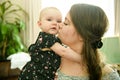 Portrait of a happy mother with cute baby at home Royalty Free Stock Photo