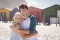 Portrait of happy mother embracing her son at beach Royalty Free Stock Photo