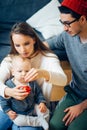 Mother, father and baby holding bauble Royalty Free Stock Photo