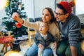 Mother, father and baby holding bauble Royalty Free Stock Photo