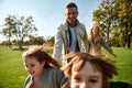 Happy weekend. Excited family running outdoors on a sunny day Royalty Free Stock Photo