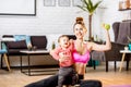 Mother exercising with her baby son at home Royalty Free Stock Photo