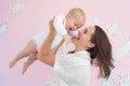 Portrait of a happy mother playing with cute baby Royalty Free Stock Photo