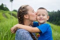 Portrait of happy mother and son at nature, Bali