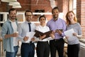 Portrait of happy motivated young multiracial business people. Royalty Free Stock Photo