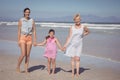 Portrait of happy multi-generation family holding hands at beach Royalty Free Stock Photo