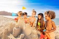 Happy kids creating sandcastle using sandpit toys Royalty Free Stock Photo