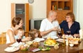 Portrait of happy multigeneration family communicate over holiday table Royalty Free Stock Photo