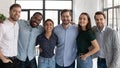 Portrait of happy multiracial colleagues posing together in office Royalty Free Stock Photo