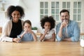 Portrait of happy multiracial family recommend drinking water