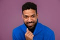 Portrait of happy multiracial man in knitted sweater. Royalty Free Stock Photo