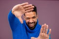 Portrait of happy multiracial man in knitted sweater. Royalty Free Stock Photo