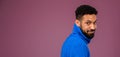 Portrait of happy multiracial man in knitted sweater. Royalty Free Stock Photo