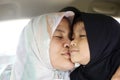 Happy Muslim Mom and Daughter, Asian mother kiss her baby girl Royalty Free Stock Photo