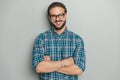 happy nerd man with glasses crossing arms and smiling Royalty Free Stock Photo