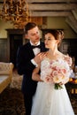 portrait of happy newlyweds in the interior. event planner services.