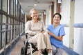 Portrait of happy nursing home resident and caregiver