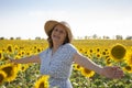 Portrait of a happy old woman in a sunflower field Royalty Free Stock Photo