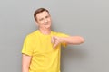 Portrait of happy optimistic man giving thumb down sign of dislike Royalty Free Stock Photo