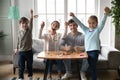 Portrait of happy parents engaged in creative activity with kids