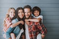 Portrait of happy parents with lovely children. Full healthy families concept.