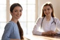 Portrait of happy patient in office of capable qualified doctor Royalty Free Stock Photo