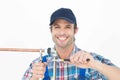 Portrait of happy plumber fixing pipe Royalty Free Stock Photo