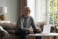 Portrait of happy elderly pensioner man in glasses enjoying accounting Royalty Free Stock Photo