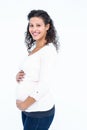 Portrait of happy pregnant woman holding abdomen Royalty Free Stock Photo